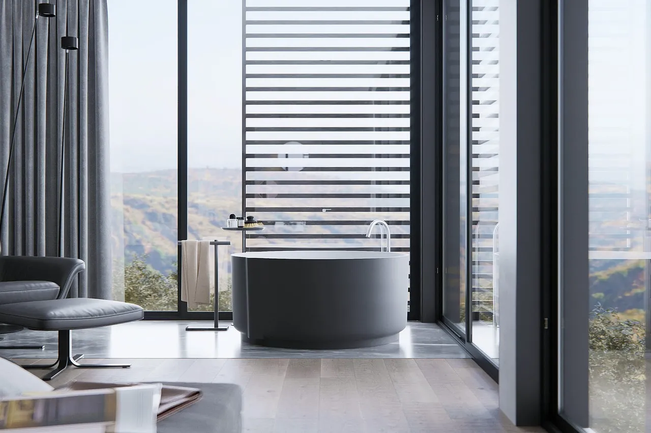 Une salle de bain ouverte sur la chambre et le dressing